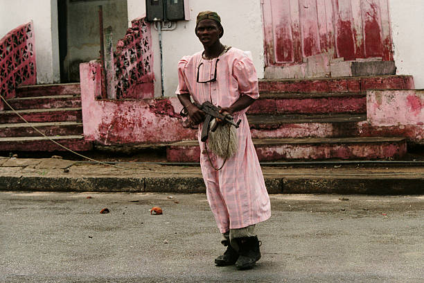 In April 1996, the Liberian State Council sent police-militia to arrest Prince Roosevelt Johnson on murder charges. As a direct result, fighting broke out in Monrovia between NPFL (National Patriotic Front of Liberia) and ULIMO-J fighters, loosely allied under Johnson. Around 1,500 people were killed in the ensuing clashes that lasted seven weeks. Fighter in the streets of Monrovia. (Photo by Patrick ROBERT/Sygma via Getty Images)